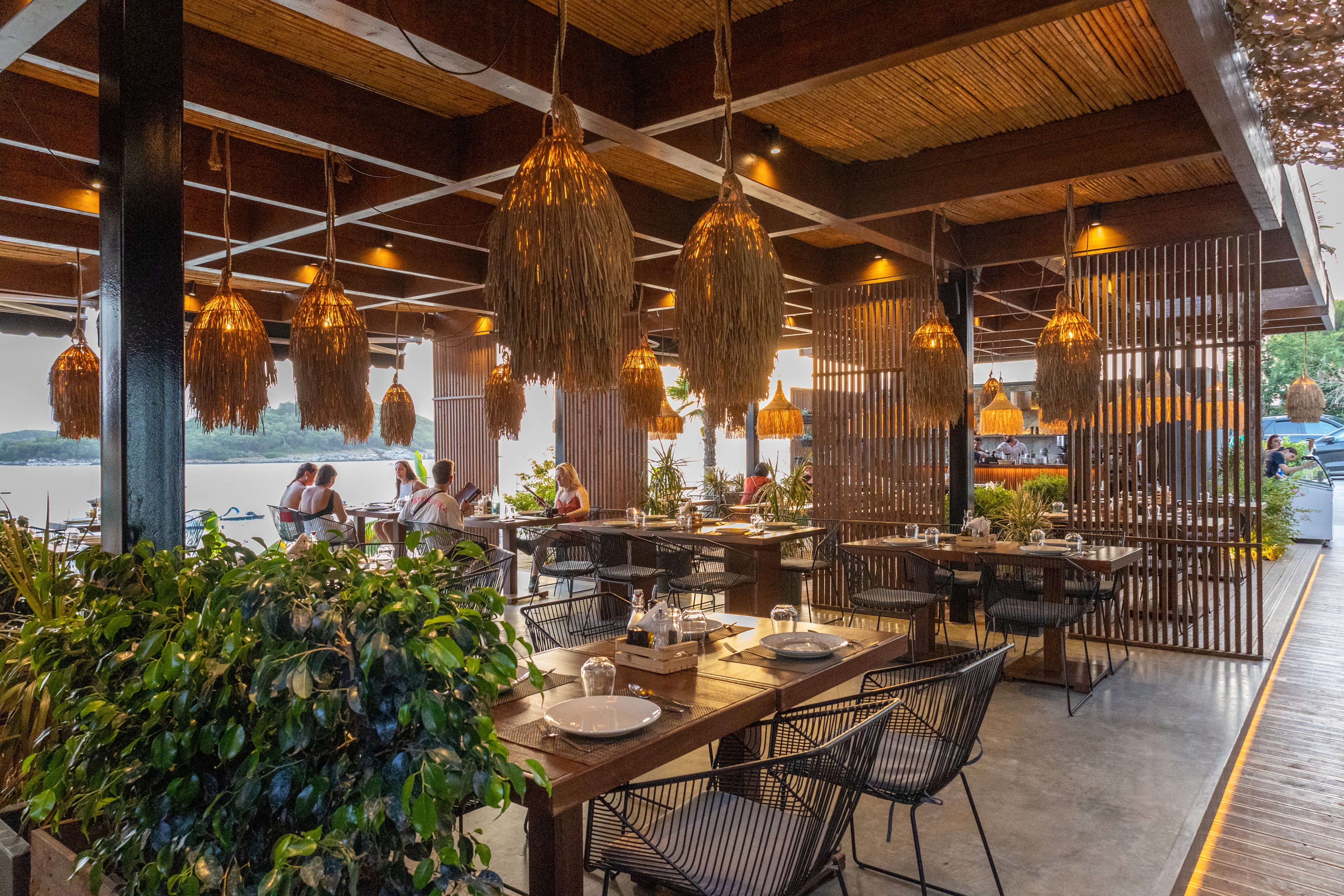 ostro-beach-bar-restaurant-modern-open-air-dining-warm-lighting